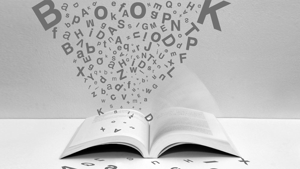 Ein Buch aus dem viele Buchstaben strömen. Ein Buch aus dem viele Buchstaben strömen.