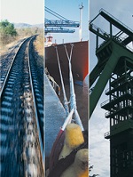 Ein Bild von einem Schiff, einer Bahnstrecke und eines Förderturms.  Ein Bild von einem Schiff, einer Bahnstrecke und eines Förderturms.